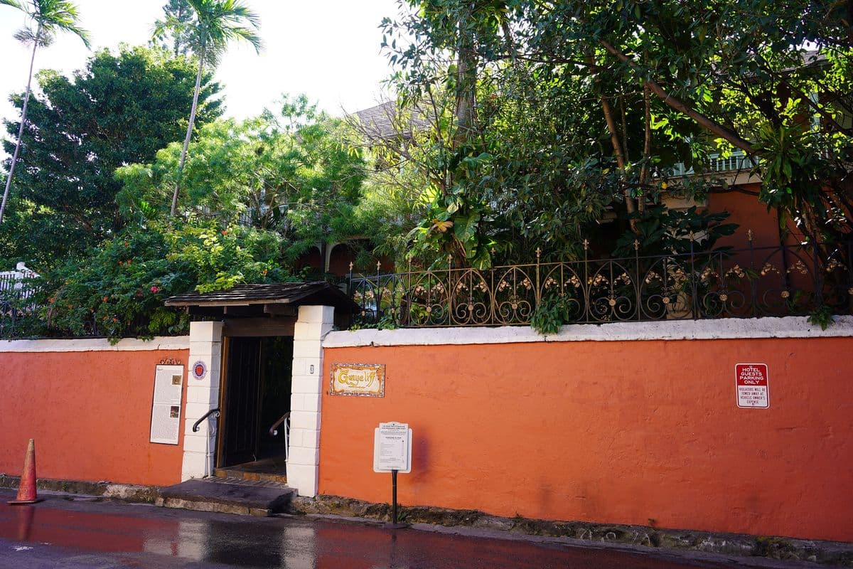 Homes behind a painted garden wall on West Hill Street, Downtown Nassau