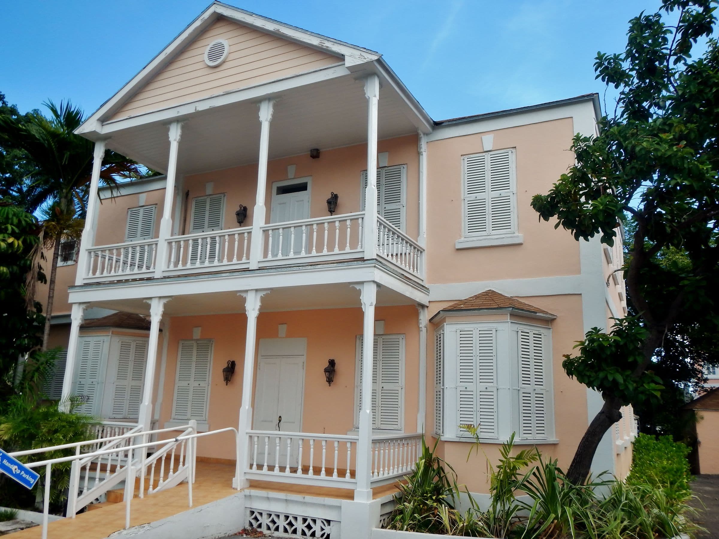 Two-storey pastel house with white verandahs, Downtown Nassau, New Providence